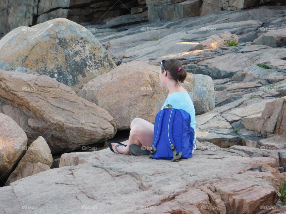 Girls sitting on the rocks