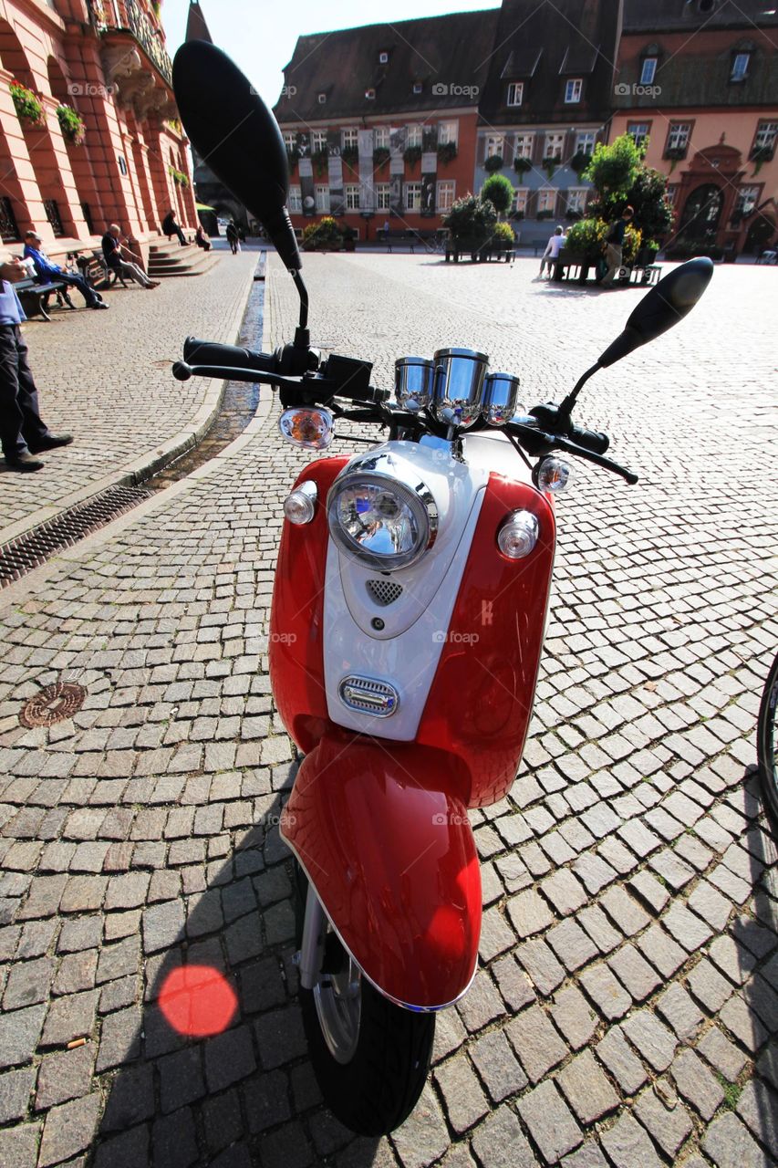 European red and white scooter