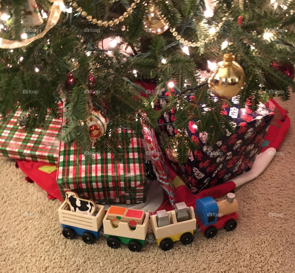 Christmas presents under a Christmas tree.