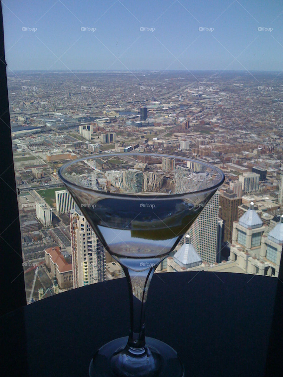martini overlooking chicago john hancock building chicago by Calden44