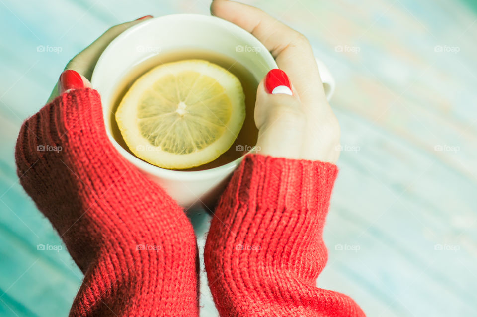 woman hand with cup of tea