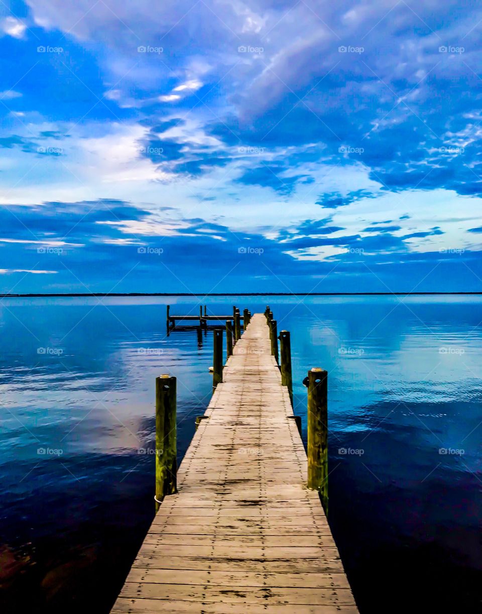 Reflection of the sky over water on the boardwalk 