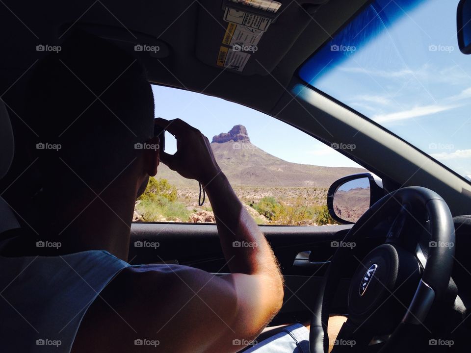 Man take a Photo from his car during the  Arizona travel