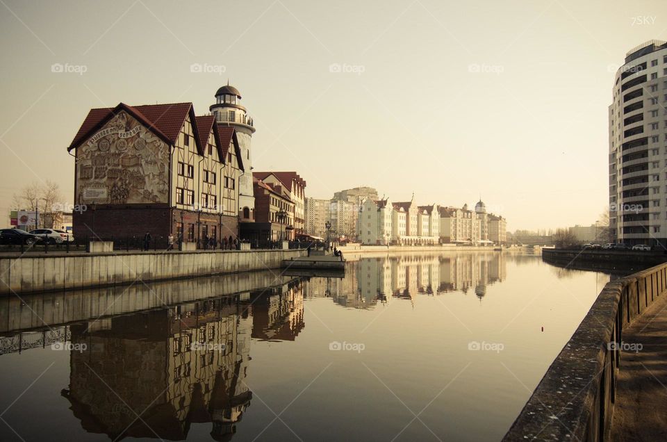 Building reflecting in lake