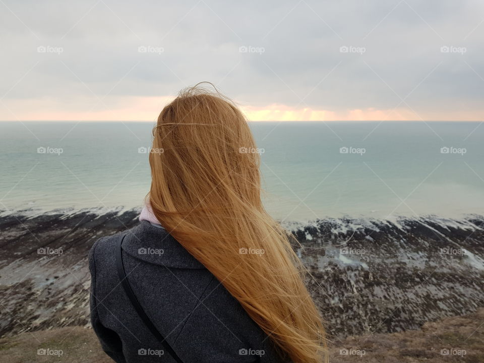 Blonde girl and the ocean
