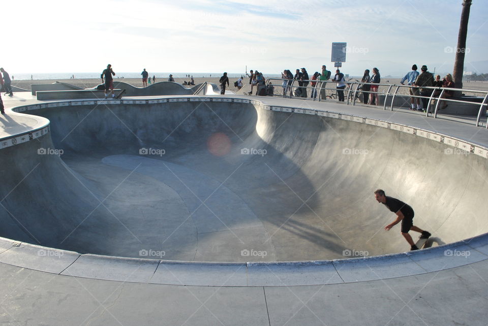 Fast kids scateboarding at Venice beach