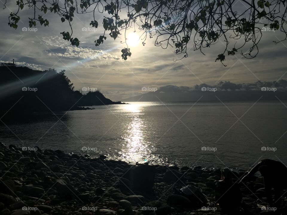 Scenic view of sea against cloudy sky