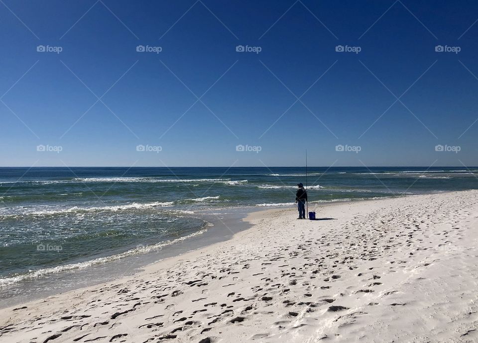 Silhouette of shore fisherman 