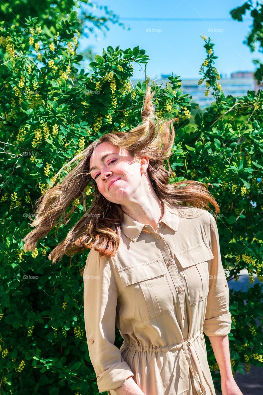 Happy woman with long fair hair