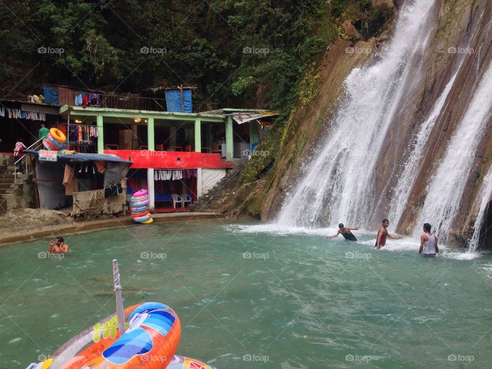 People enjoying in waterfall