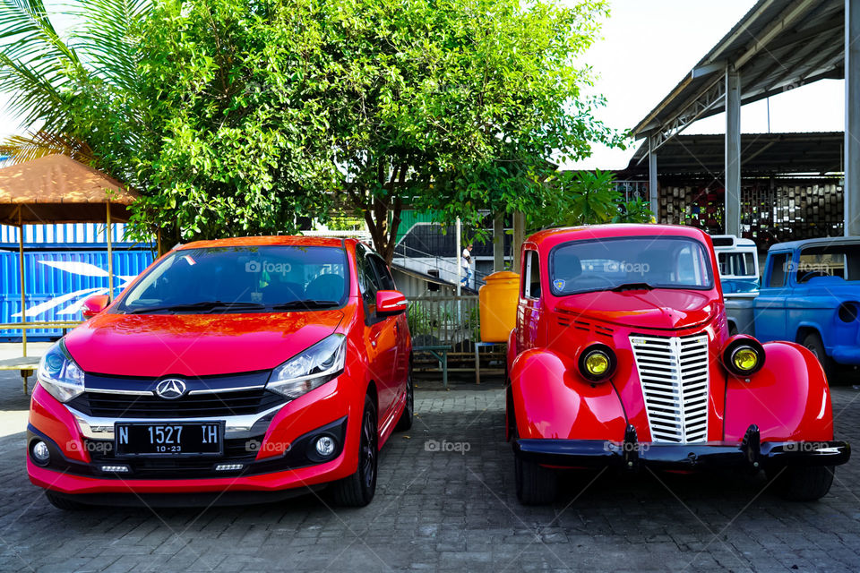 classic and new car in red. which one you'll choose