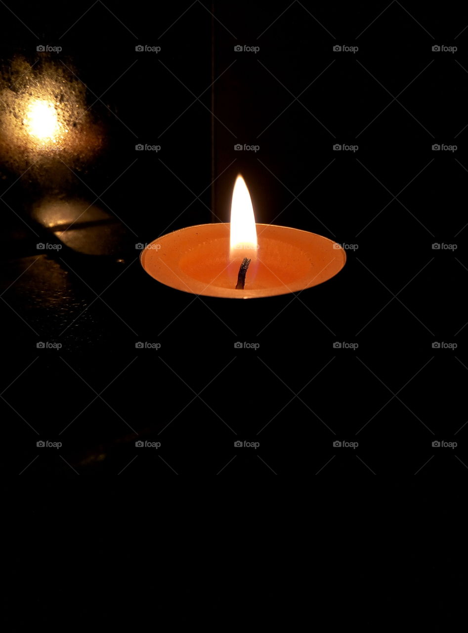 Candle in the dark bathroom