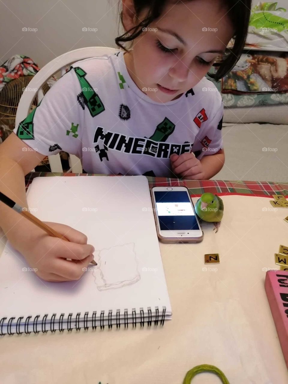 Little bird is very interesting in the girls art work 