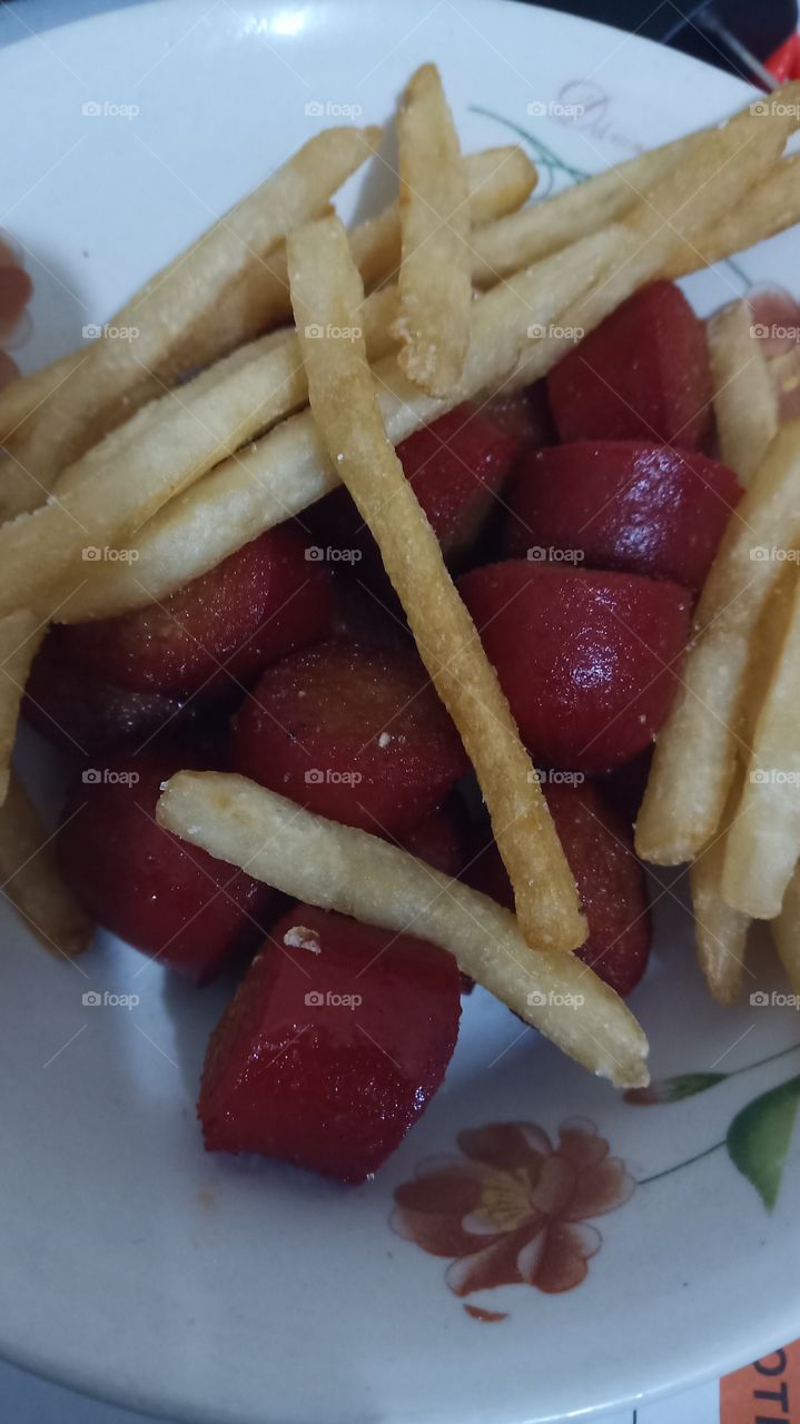 Fries and hotdogs.