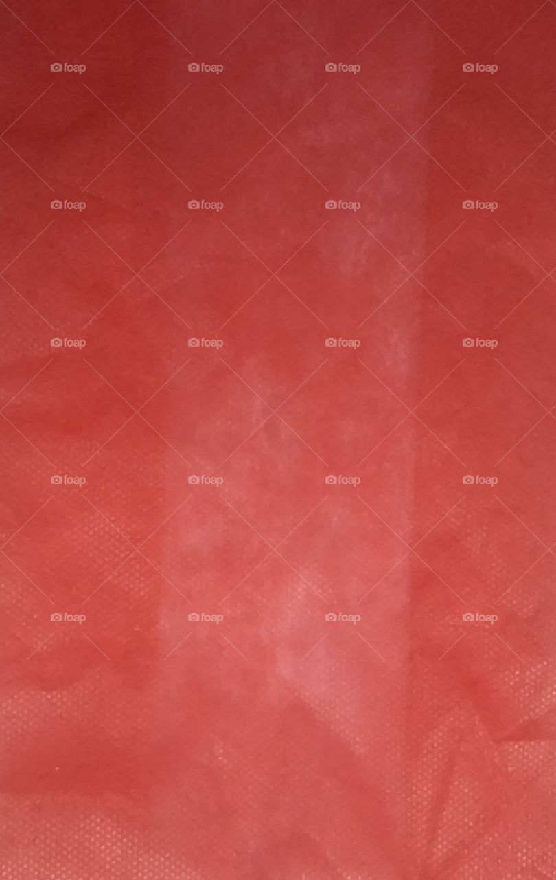 It is a Backgrounds Red Textured full frame textile abstract close up in Patna India