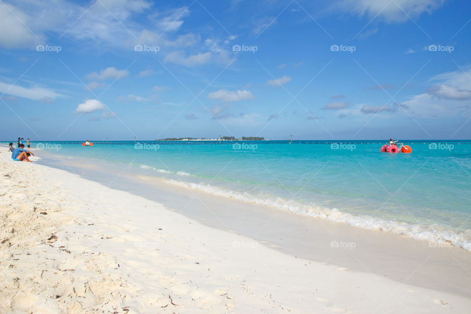 Beach life on a beautiful sandy beach in fair weather 