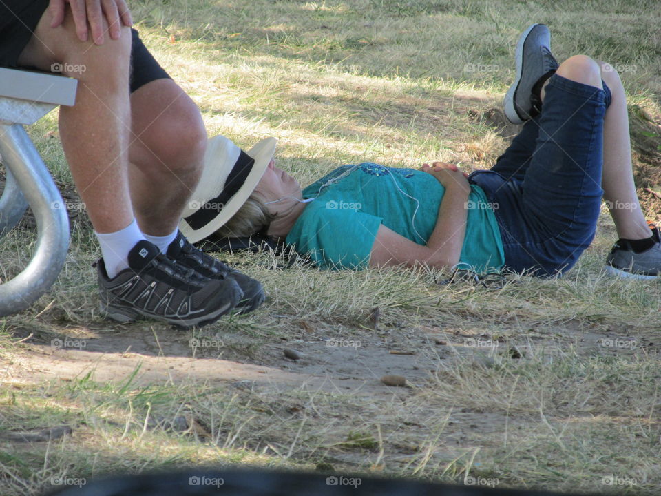 lady relaxing on grass