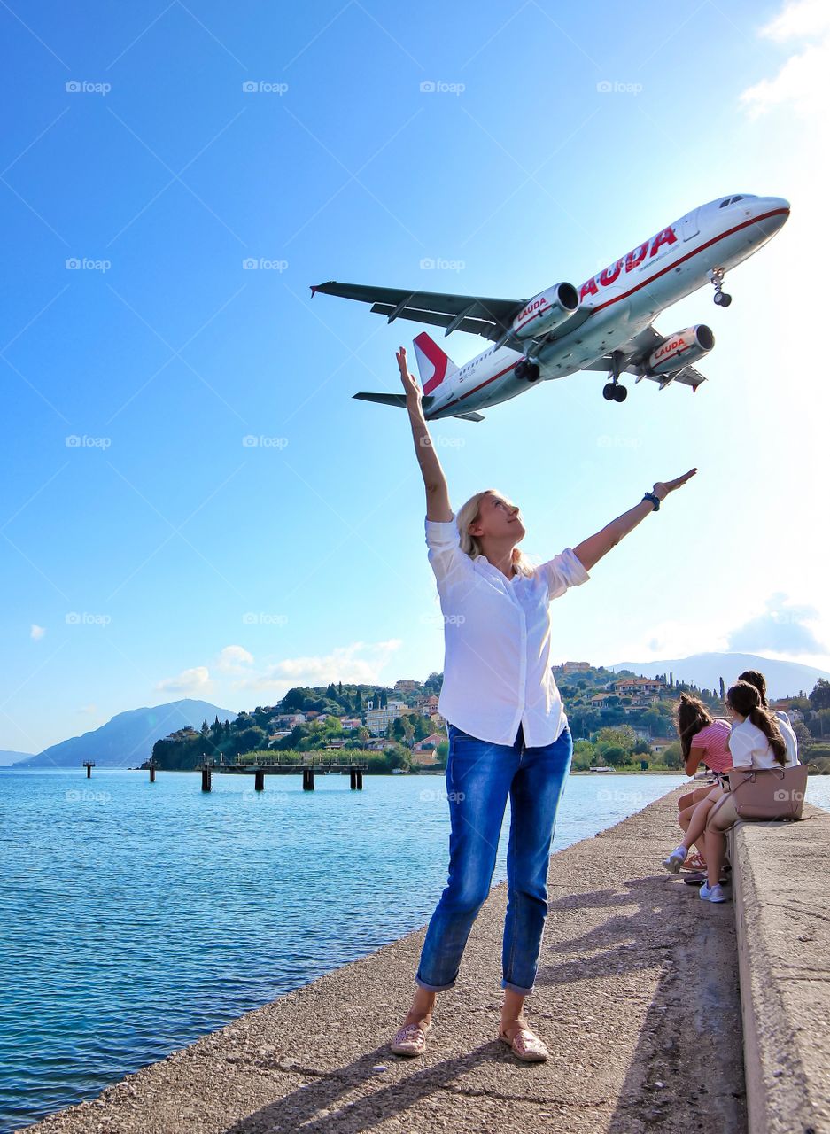 Woman catches a flying plane