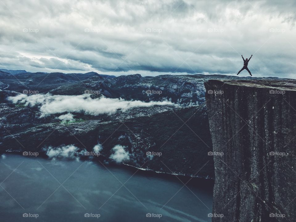 Person with arms outstretched jumping