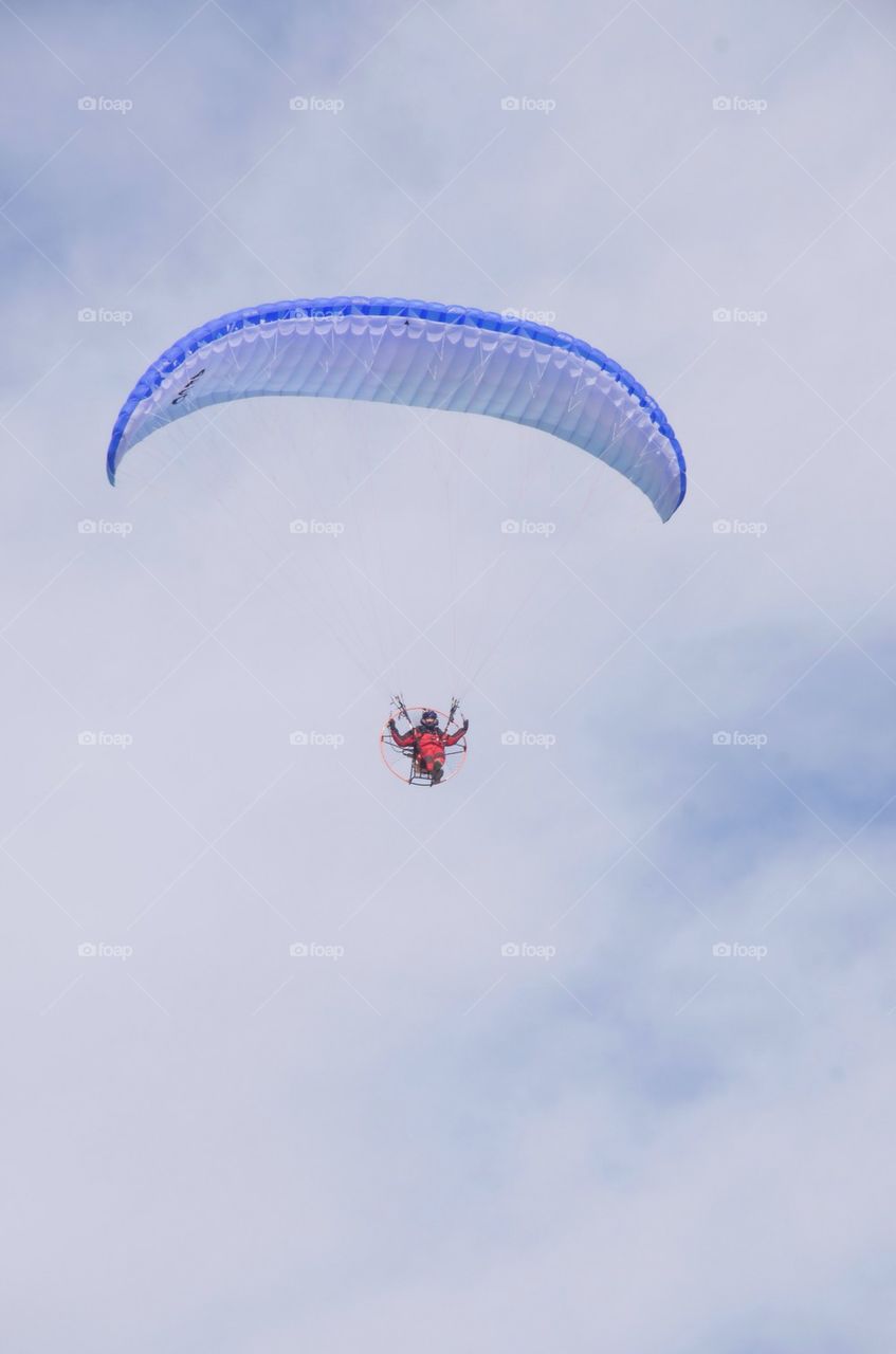 Paramotor with clouds background