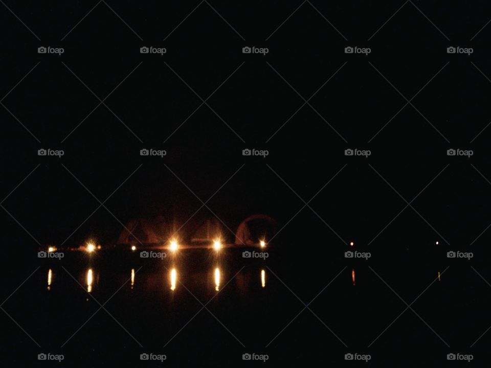 camping tents with candle light on the lake