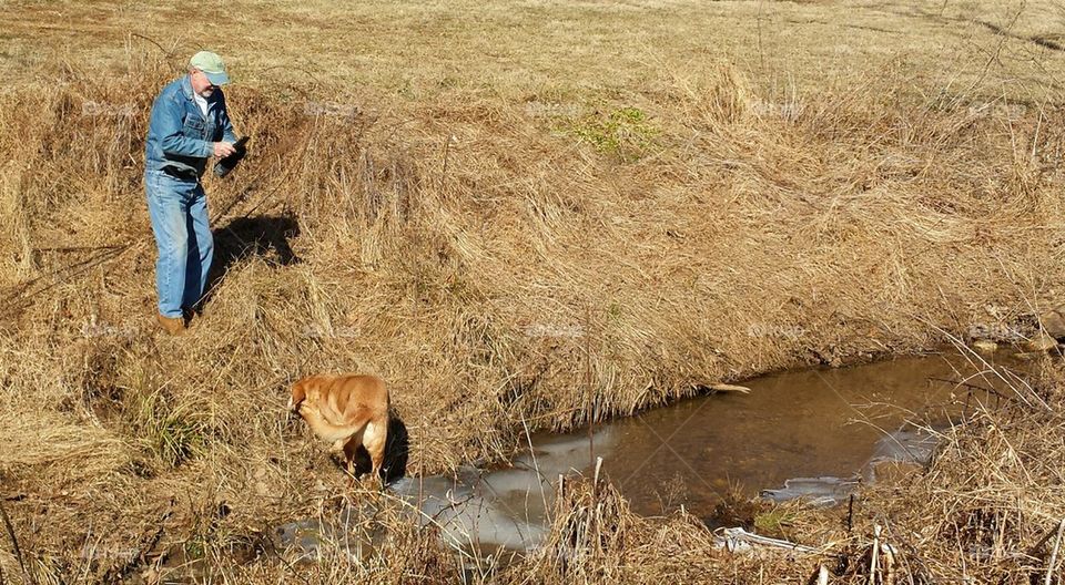 man and dog enjoying nature