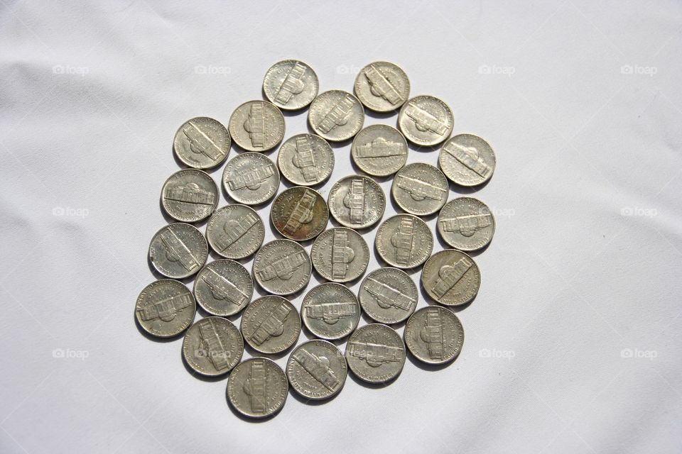 Coins are used daily. Ellipsis are all around us. In your pocket and used in the shop