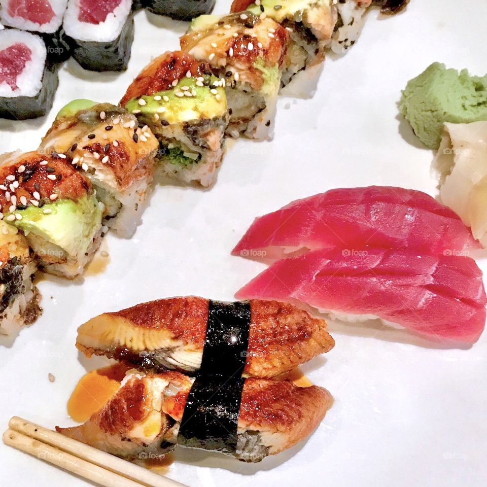 Sushi tuna, salmon, tempura shrimp roll with eel sauce, eel, ginger, wasabi, and chop sticks 🍣