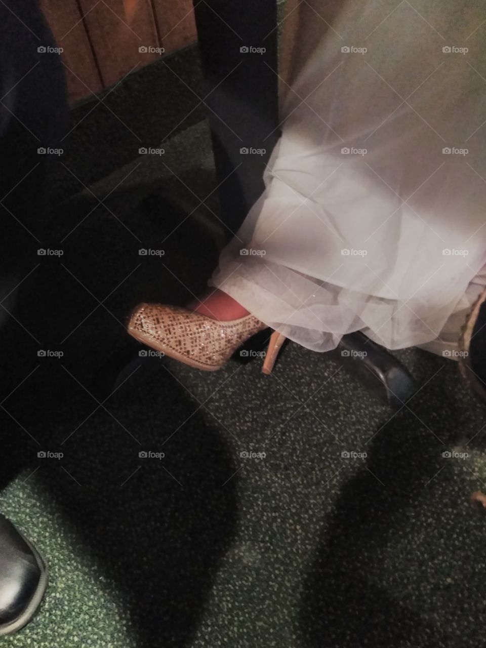 we were sitting at a table talking,  I happen to look down see the brides beautiful shoe,  so I snapped a pucture