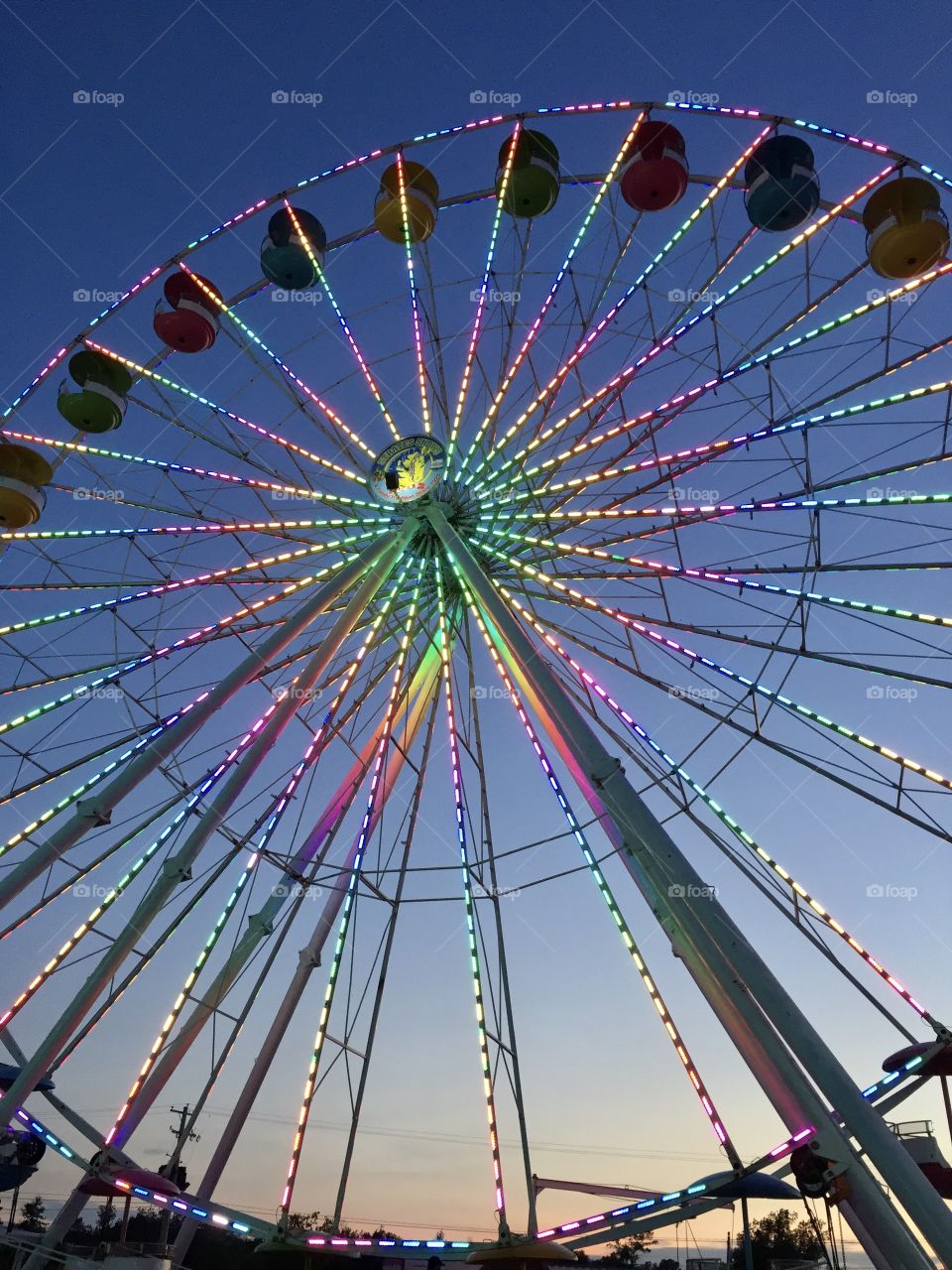 Ferris wheel at festival at sunset
