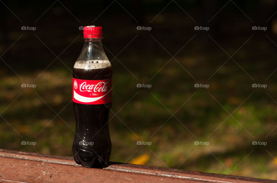 Coca Cola bottle and space for text