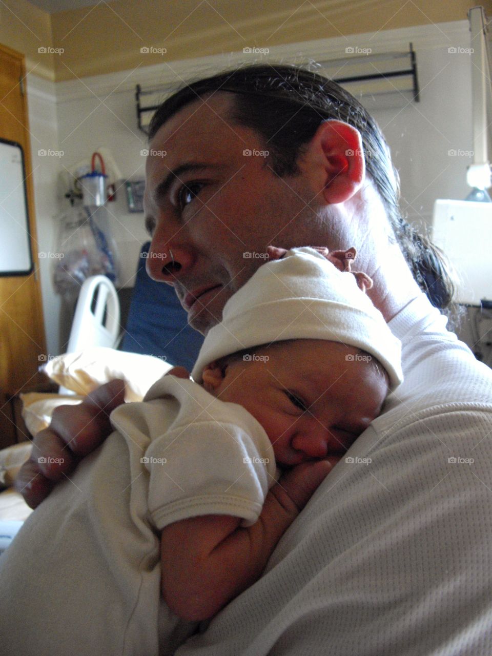 Close-up of a father carrying his son