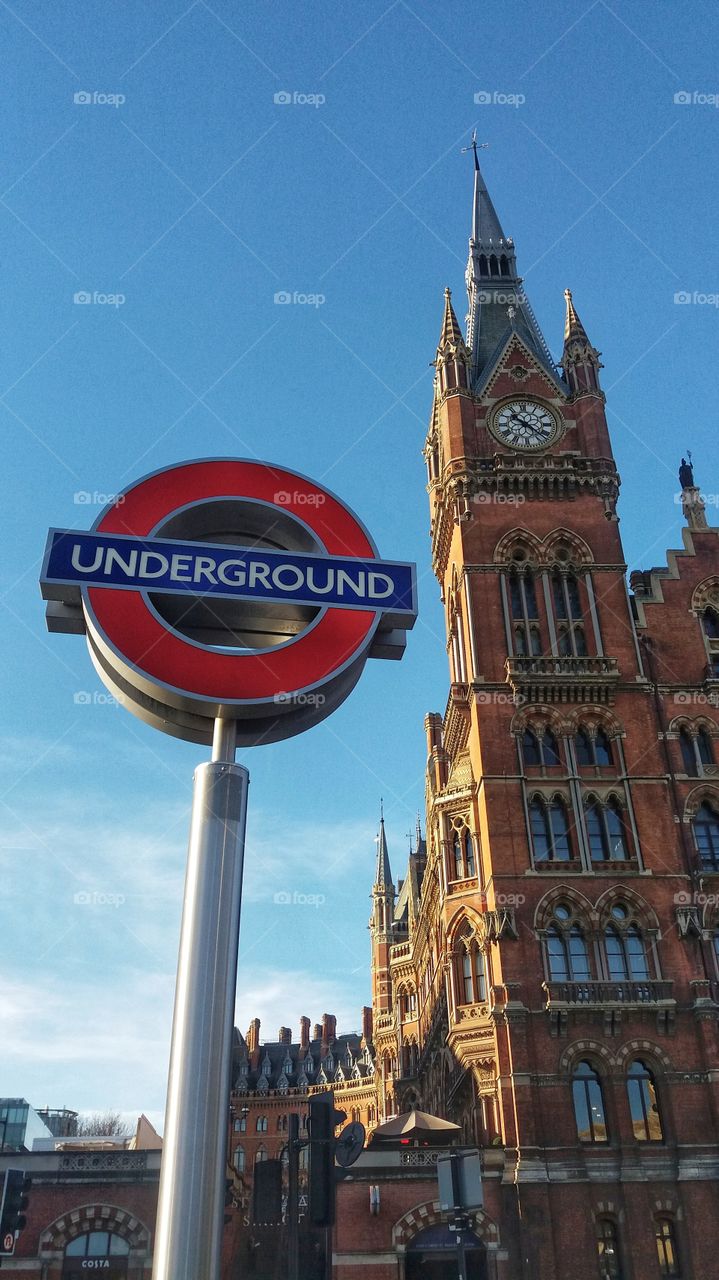 A London Underground sign next to The St Pancras International Renaissance Hotel in Kings Cross, London.