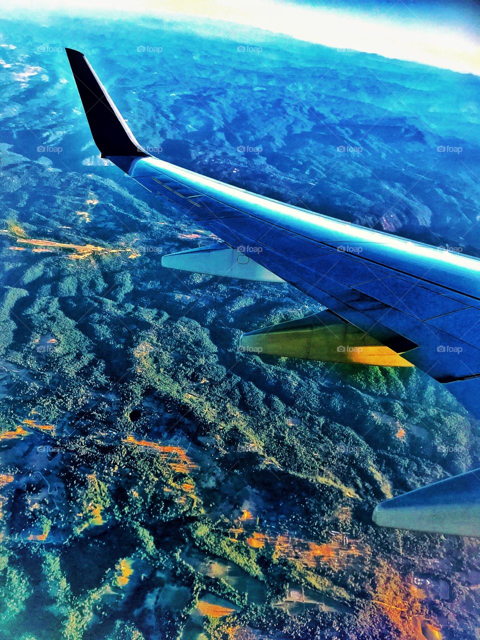 Mountains landscape aerial view, airplane wing