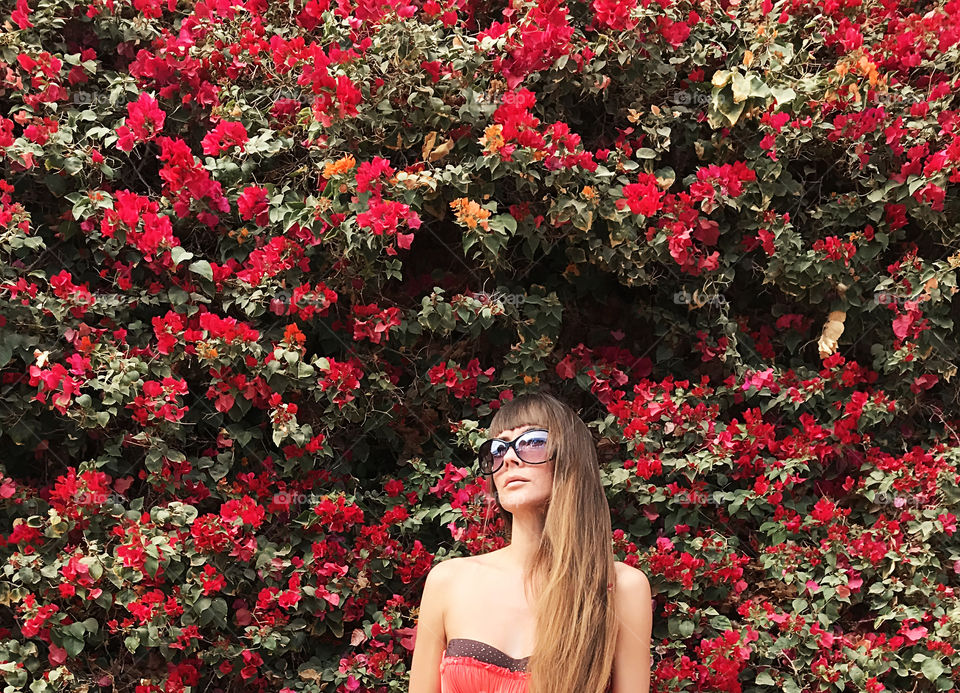 Young woman on floral background 