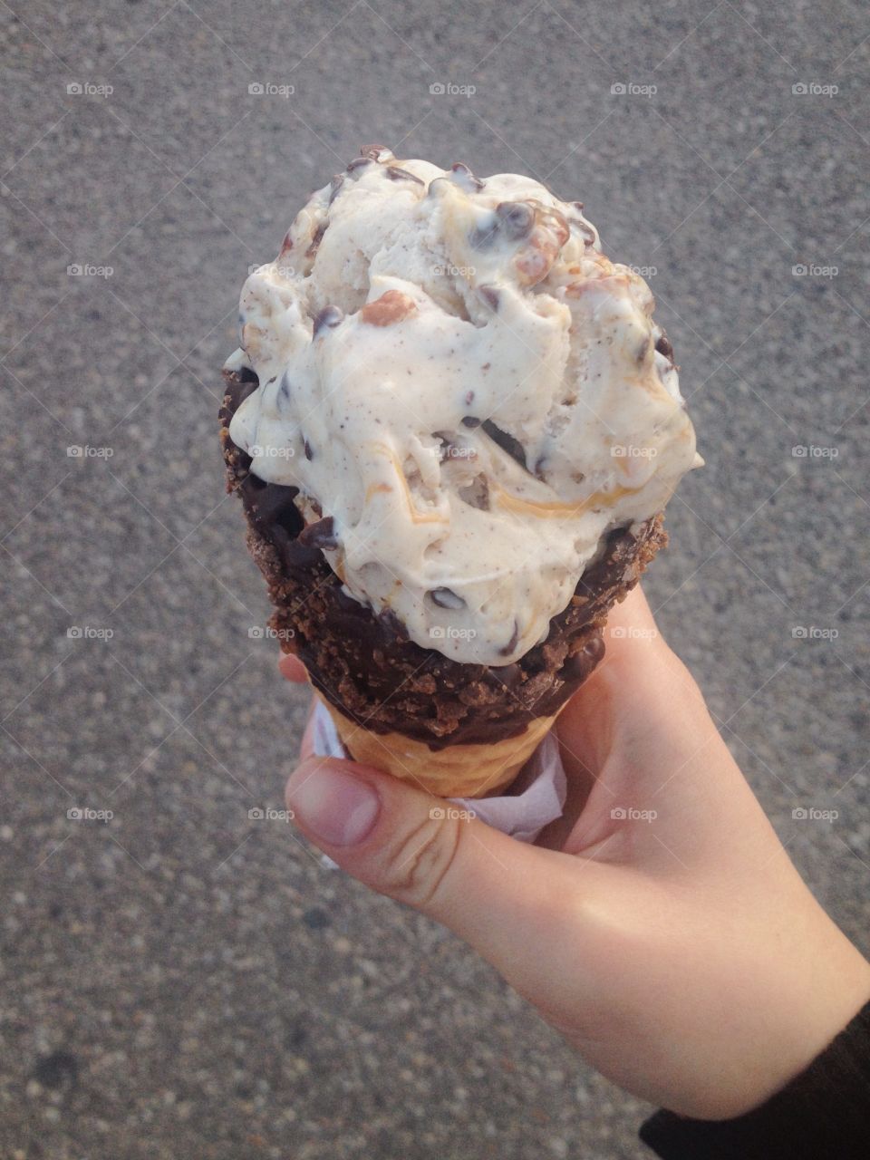 A gigantic chocolate dipped ice cream cone