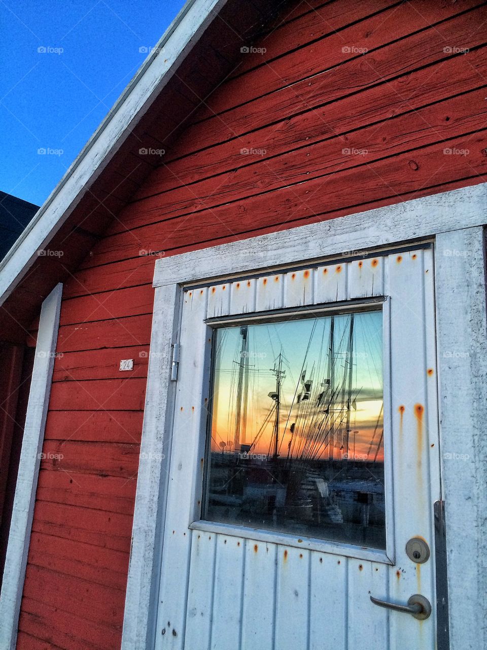 Sunset reflected on door glass