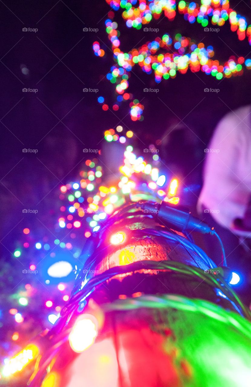 Close up of holiday lights with colorful bokeh background. 