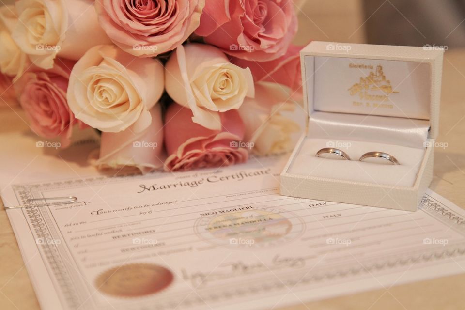 marriage certificate and rings