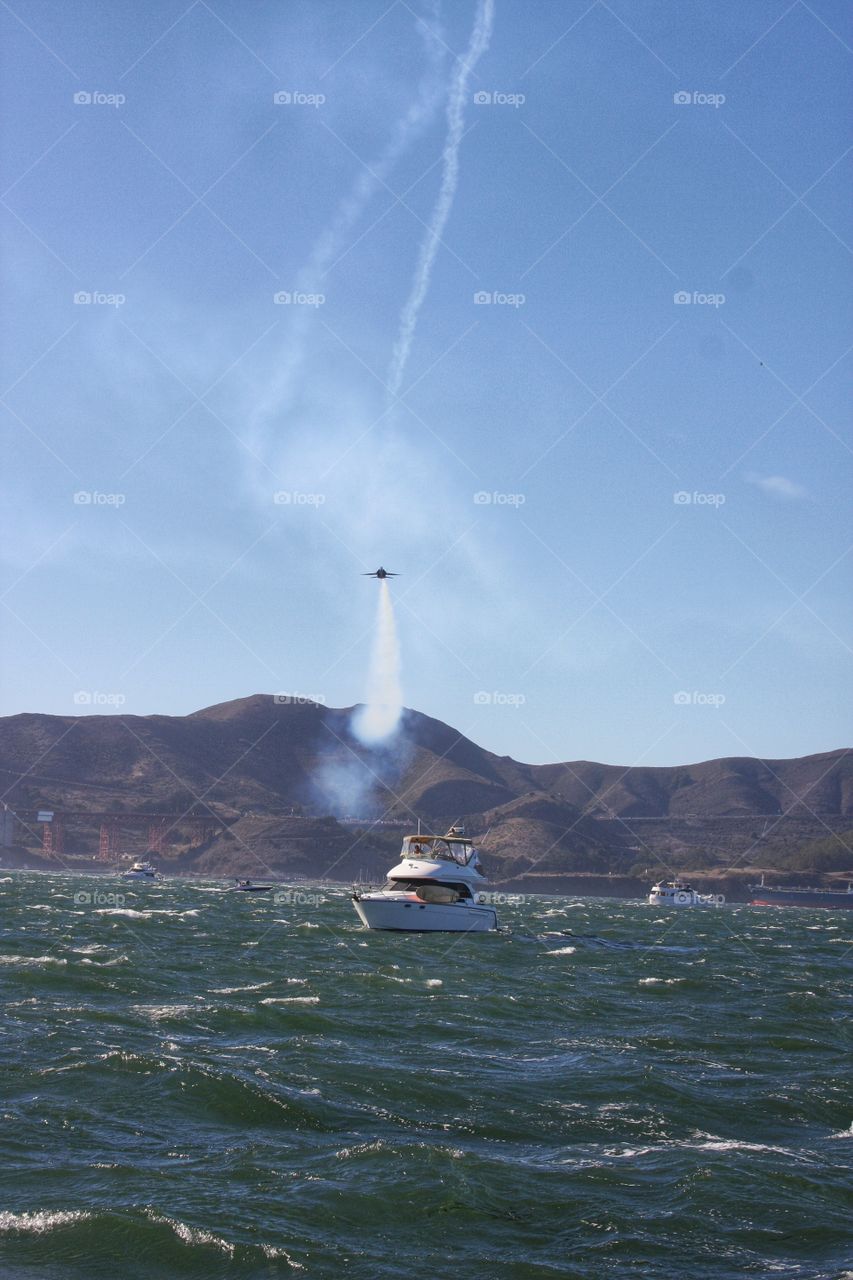 Fleet Week. Blue Angel buzzing boats in the San Francisco Bay