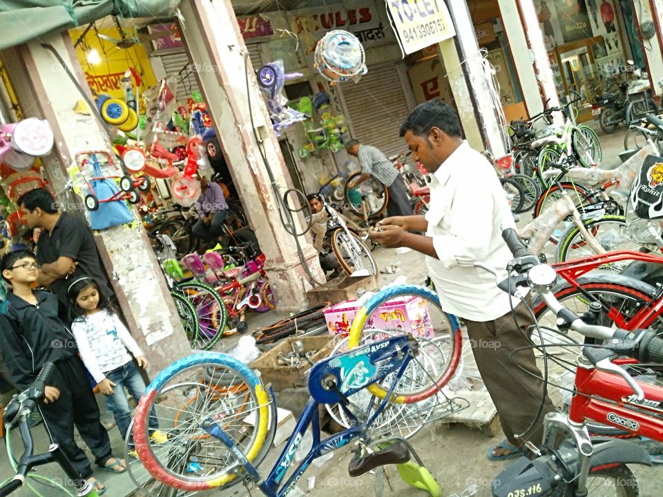 Repair man repairing bicycle