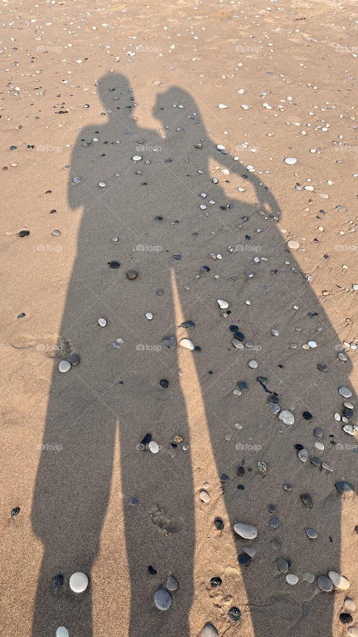 The shadow of love on the beach