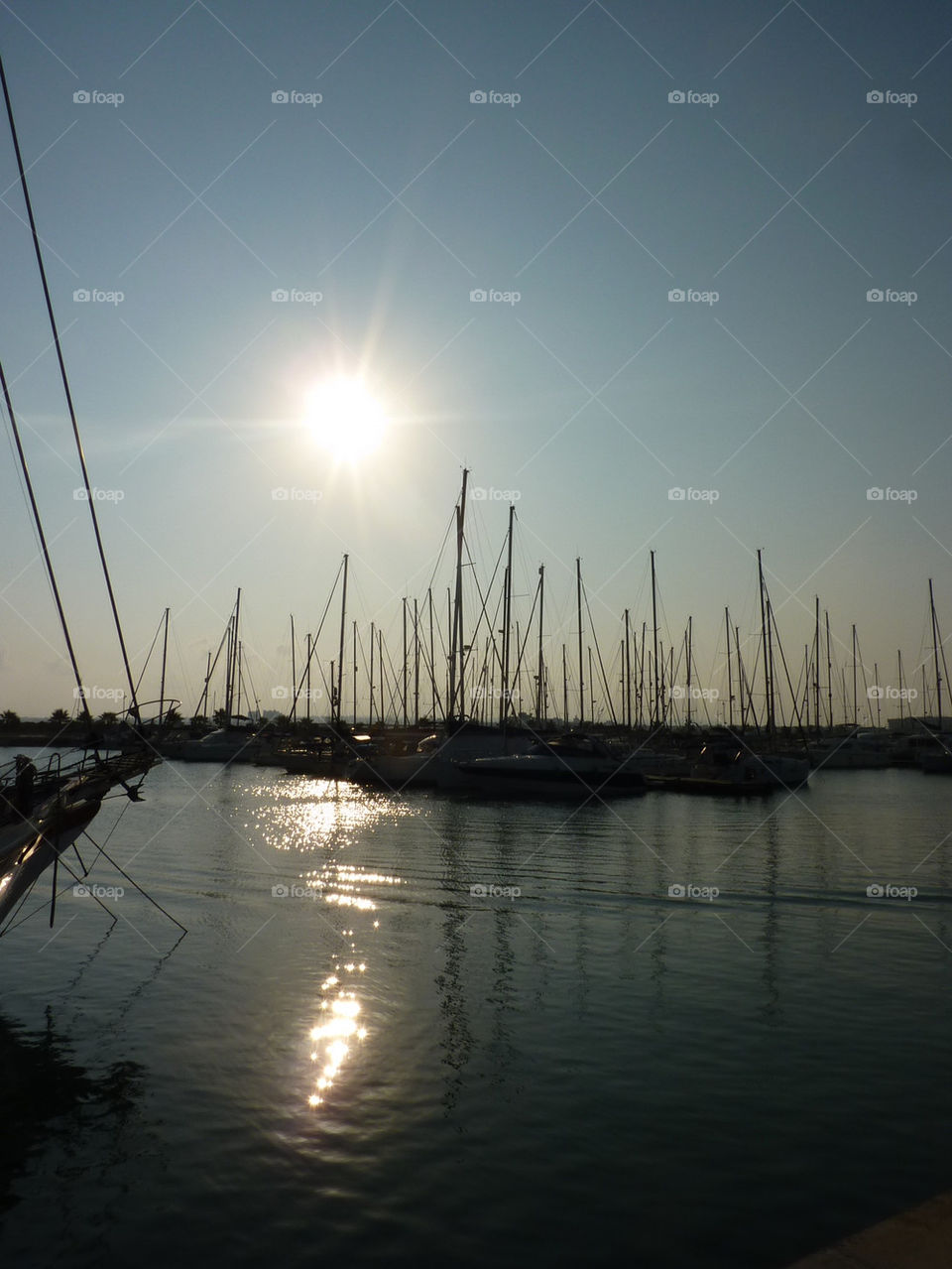 boats sun water evening by lizajones
