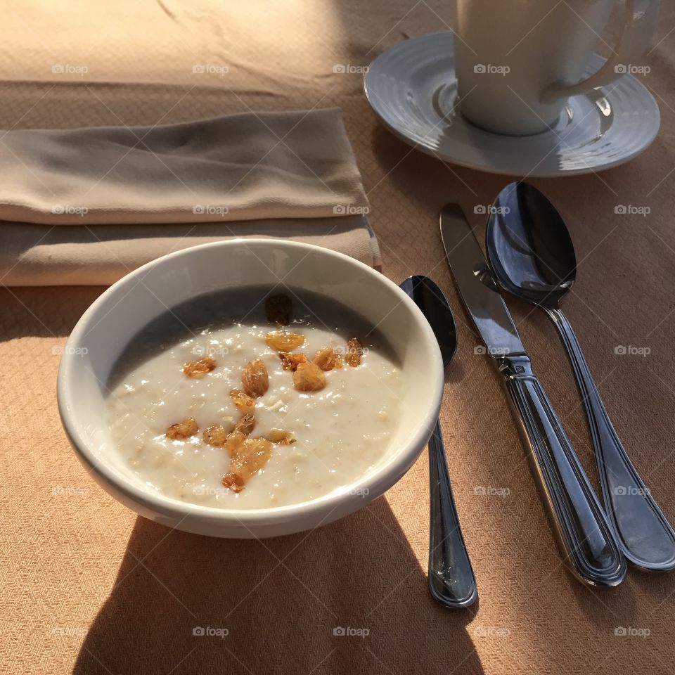 Breakfast, proper nutrition. Porridge, loaf, pancakes with honey and jam, donut, croissant. Cheese, Egg, Lettuce