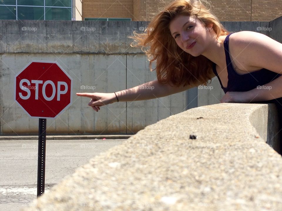 Stop. K Bruce (model) with stop sign