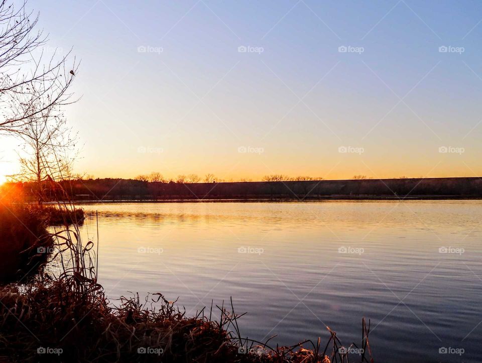 Stunning sunset over water front. "Last Kiss Goodnight".