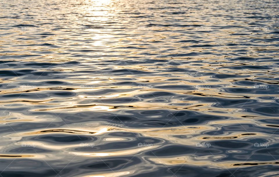 Detail and textura of sea water at sunset