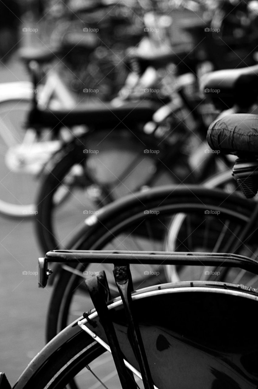 Many bicycles in the bicycle garage - black and white