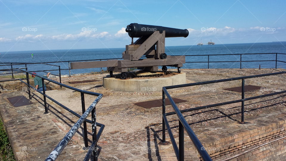 Quite Gun forever Guarding the Gulf Coast and Mobile bay against Ghost of the past!. Took this picture while on Gulf Coast Vacation. The guide said all the guns were still operational. they are fired twice a years by civil war re-in-actors!