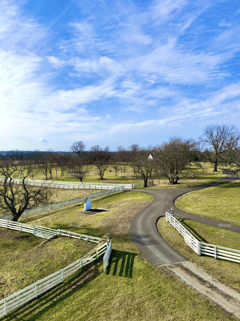 White fences and clean driveways on a farm in the country
